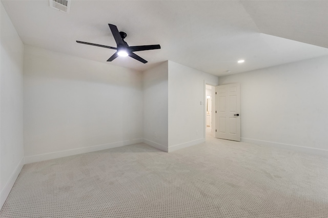 empty room with ceiling fan and light colored carpet