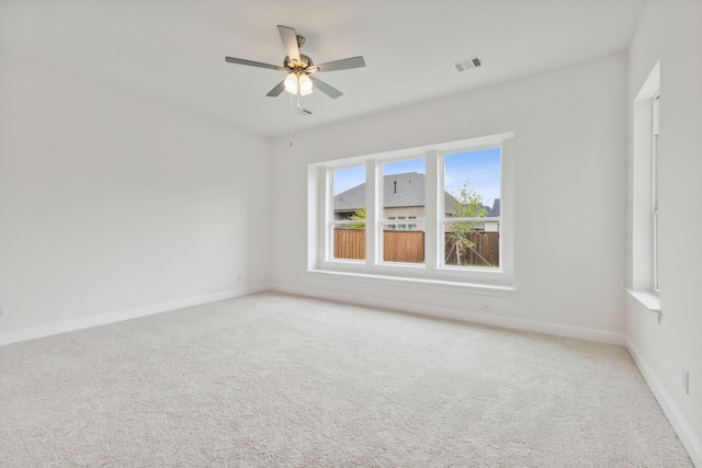 unfurnished room with carpet floors and ceiling fan