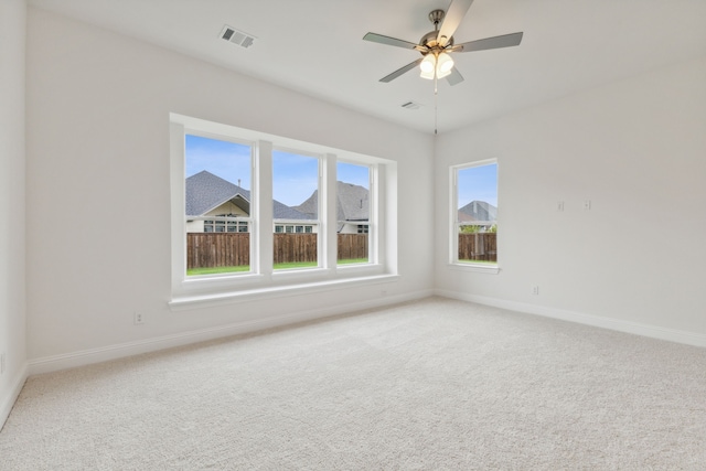 carpeted empty room with ceiling fan