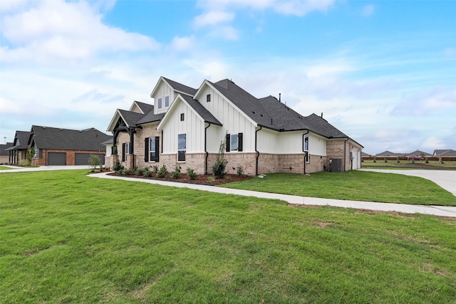 view of front of property featuring a front lawn and a garage