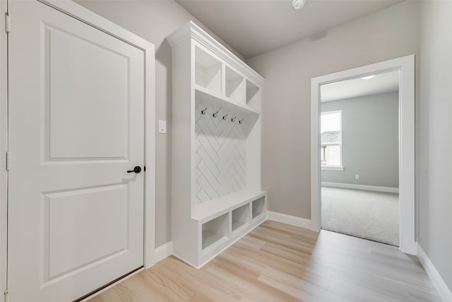 mudroom with light hardwood / wood-style floors