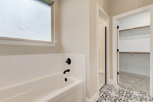 bathroom featuring a tub to relax in