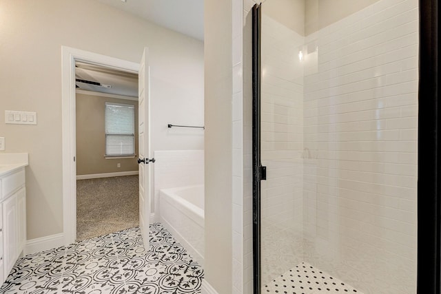 bathroom with vanity and separate shower and tub