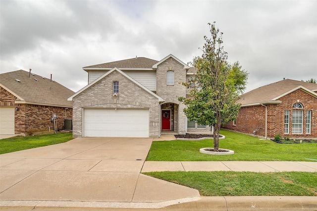 view of front property with a garage, central AC, and a front lawn