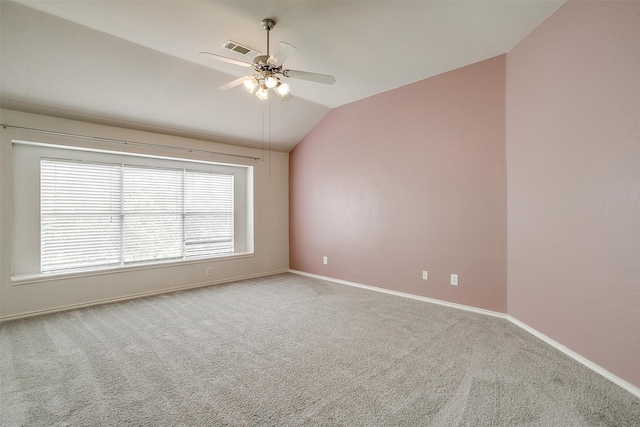 spare room with carpet, lofted ceiling, and ceiling fan