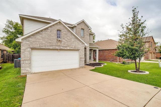 view of front of property featuring a garage, a front lawn, and central air condition unit