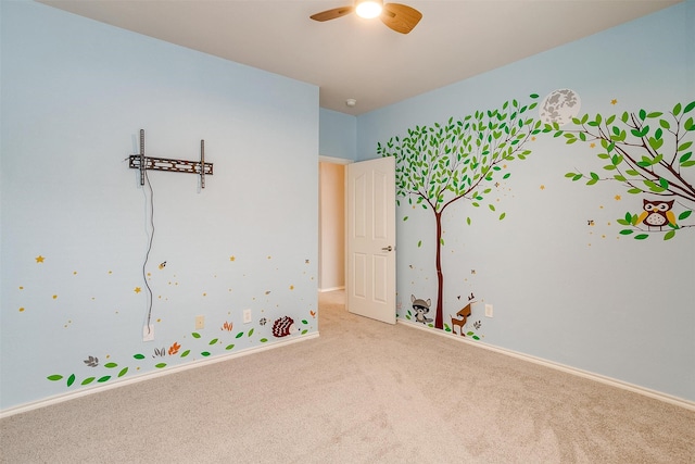 interior space featuring ceiling fan and light colored carpet