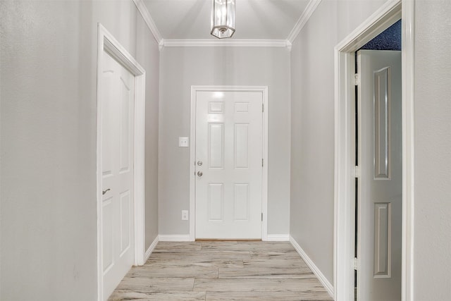 entrance foyer with light hardwood / wood-style floors and ornamental molding