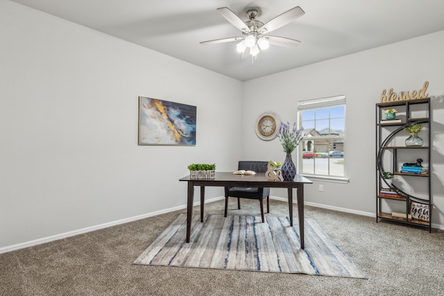 carpeted home office with ceiling fan