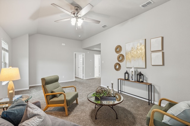 carpeted living room featuring ceiling fan and vaulted ceiling