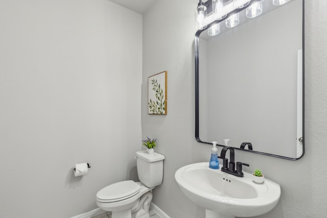 bathroom with toilet and sink