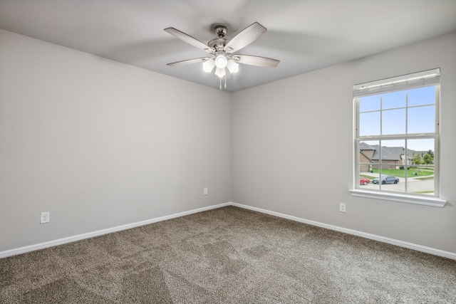 carpeted empty room with ceiling fan