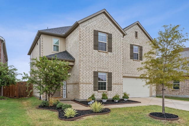 front facade with a front lawn and a garage