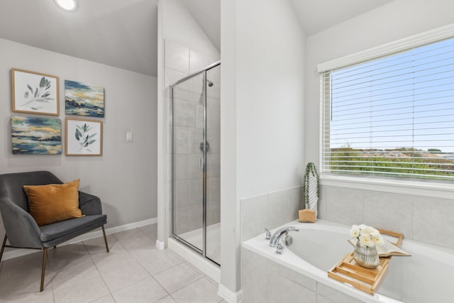 bathroom featuring plus walk in shower, tile patterned flooring, and lofted ceiling