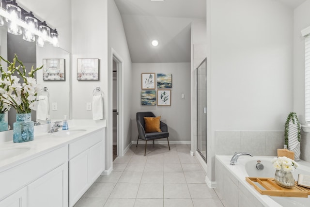 bathroom with vanity, shower with separate bathtub, vaulted ceiling, and tile patterned flooring