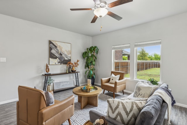 sitting room with ceiling fan and hardwood / wood-style floors