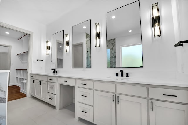 bathroom with hardwood / wood-style flooring and vanity