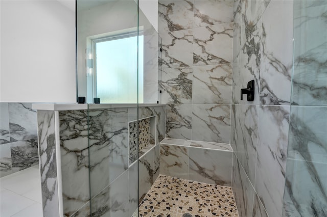 bathroom with tiled shower