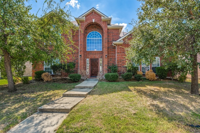 front facade featuring a front yard