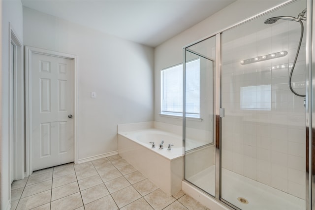 bathroom with shower with separate bathtub and tile patterned floors