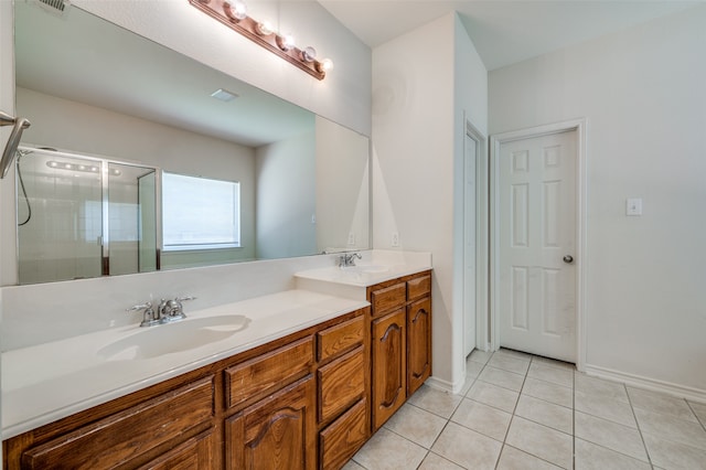 bathroom with vanity, a shower with shower door, and tile patterned flooring