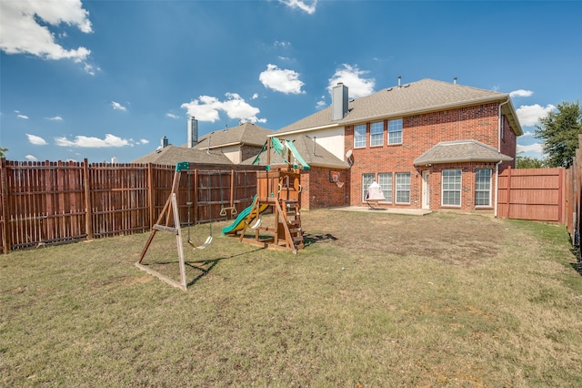 view of jungle gym with a lawn