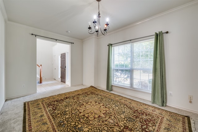 spare room with ornamental molding, a chandelier, and light colored carpet