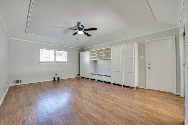 interior space featuring light wood-type flooring, ceiling fan, and crown molding