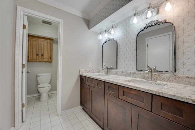 bathroom with vanity, crown molding, toilet, and tile patterned flooring