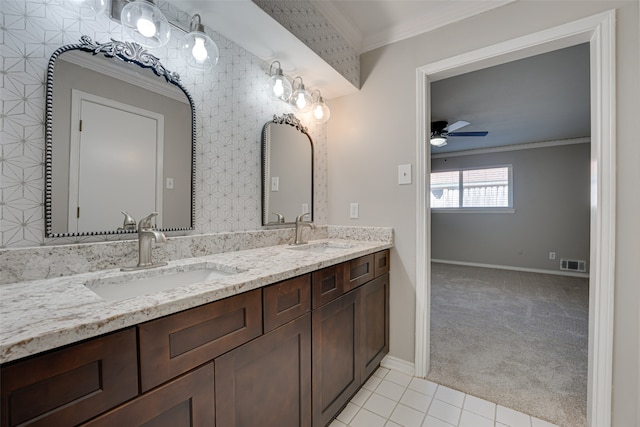 bathroom featuring tile patterned flooring, ceiling fan, vanity, and crown molding