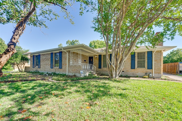 ranch-style house with a front lawn