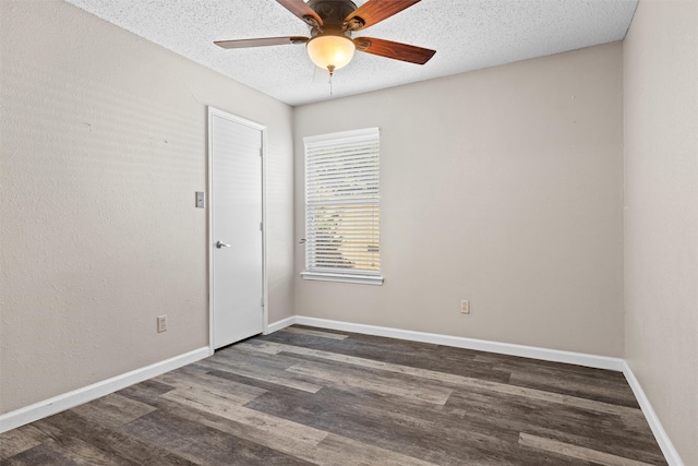 unfurnished room featuring a textured ceiling, ceiling fan, and dark wood-type flooring