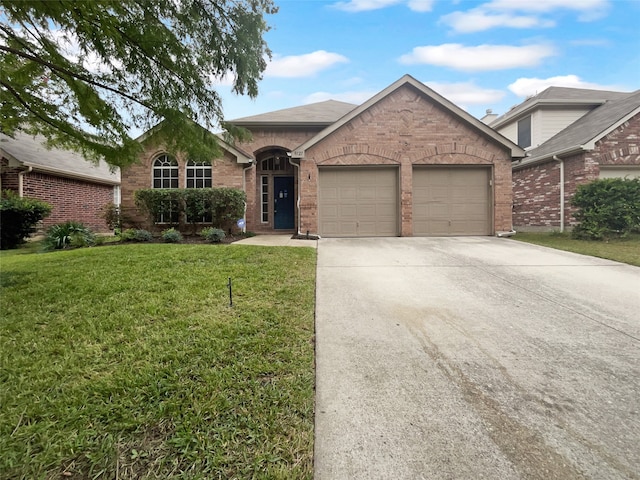 single story home with a front yard and a garage