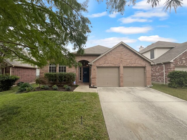 ranch-style home with a front yard and a garage