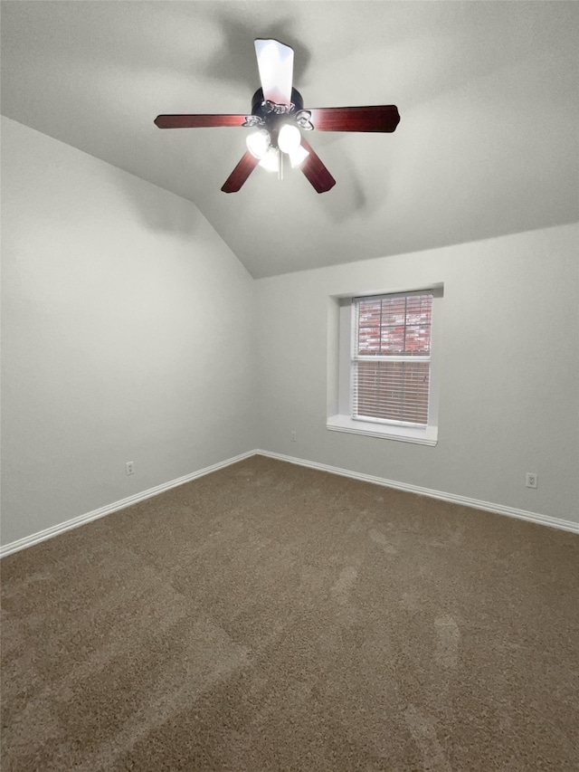 carpeted empty room with lofted ceiling and ceiling fan