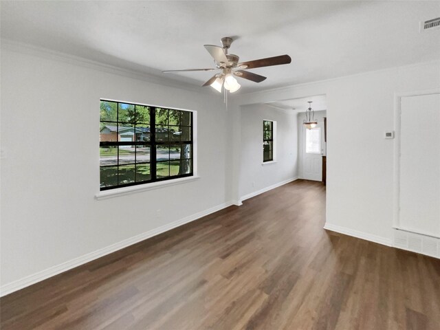 spare room featuring ceiling fan, crown molding, and dark hardwood / wood-style flooring