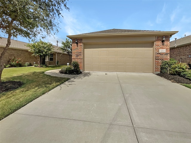 view of front of house featuring a front yard and a garage