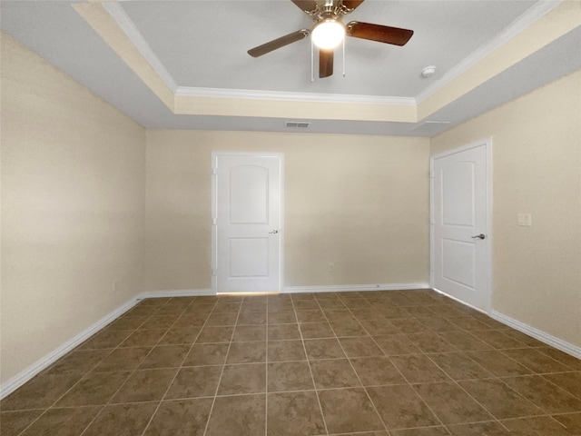 unfurnished room featuring ceiling fan, a raised ceiling, and crown molding