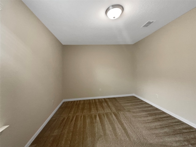 spare room featuring carpet flooring