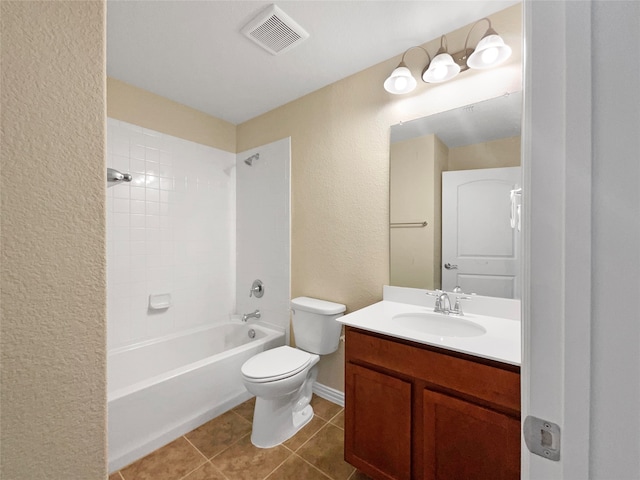 full bathroom featuring tile patterned flooring, vanity, toilet, and tiled shower / bath