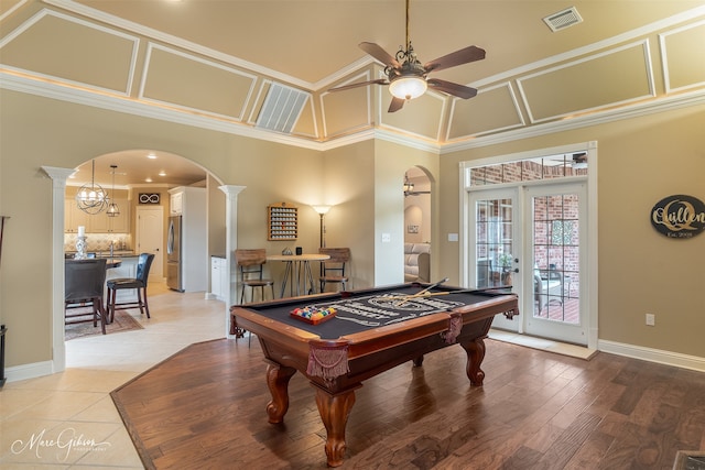 recreation room featuring decorative columns, french doors, billiards, ornamental molding, and ceiling fan with notable chandelier