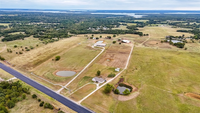 drone / aerial view with a rural view and a water view