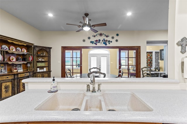 details featuring ceiling fan, sink, and french doors