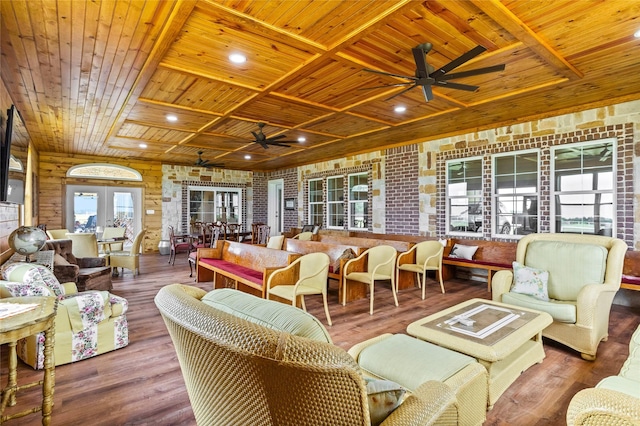 living room featuring hardwood / wood-style flooring, wooden ceiling, and french doors