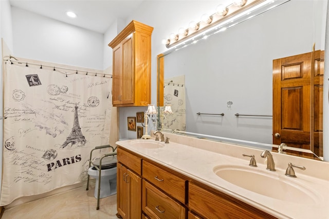 bathroom with tile patterned flooring, vanity, and a shower with curtain