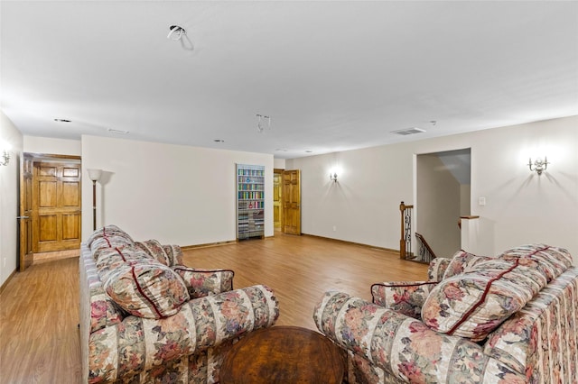 living room with light hardwood / wood-style flooring