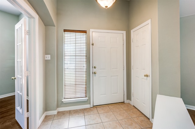 entrance foyer with light tile patterned flooring