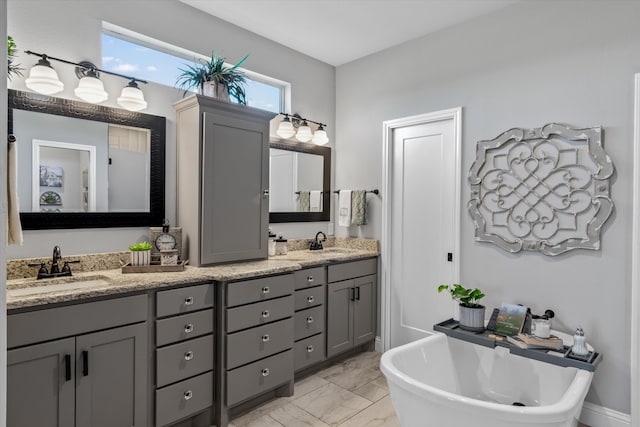 bathroom featuring vanity and a tub to relax in