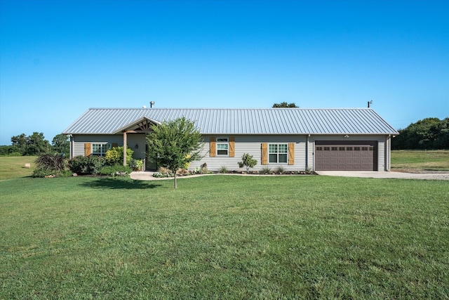 ranch-style home with a garage and a front lawn