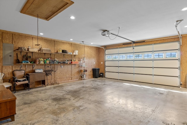 garage featuring a garage door opener and electric panel